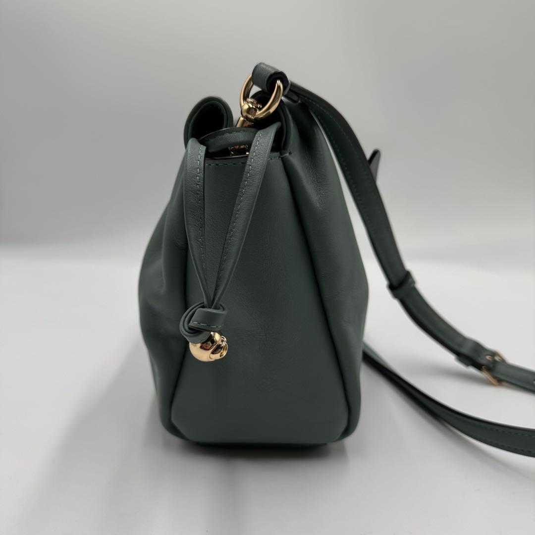 美品✨ コーチ フェイ ドローストリングバッグ レザー 巾着 ゴールド金具 水色