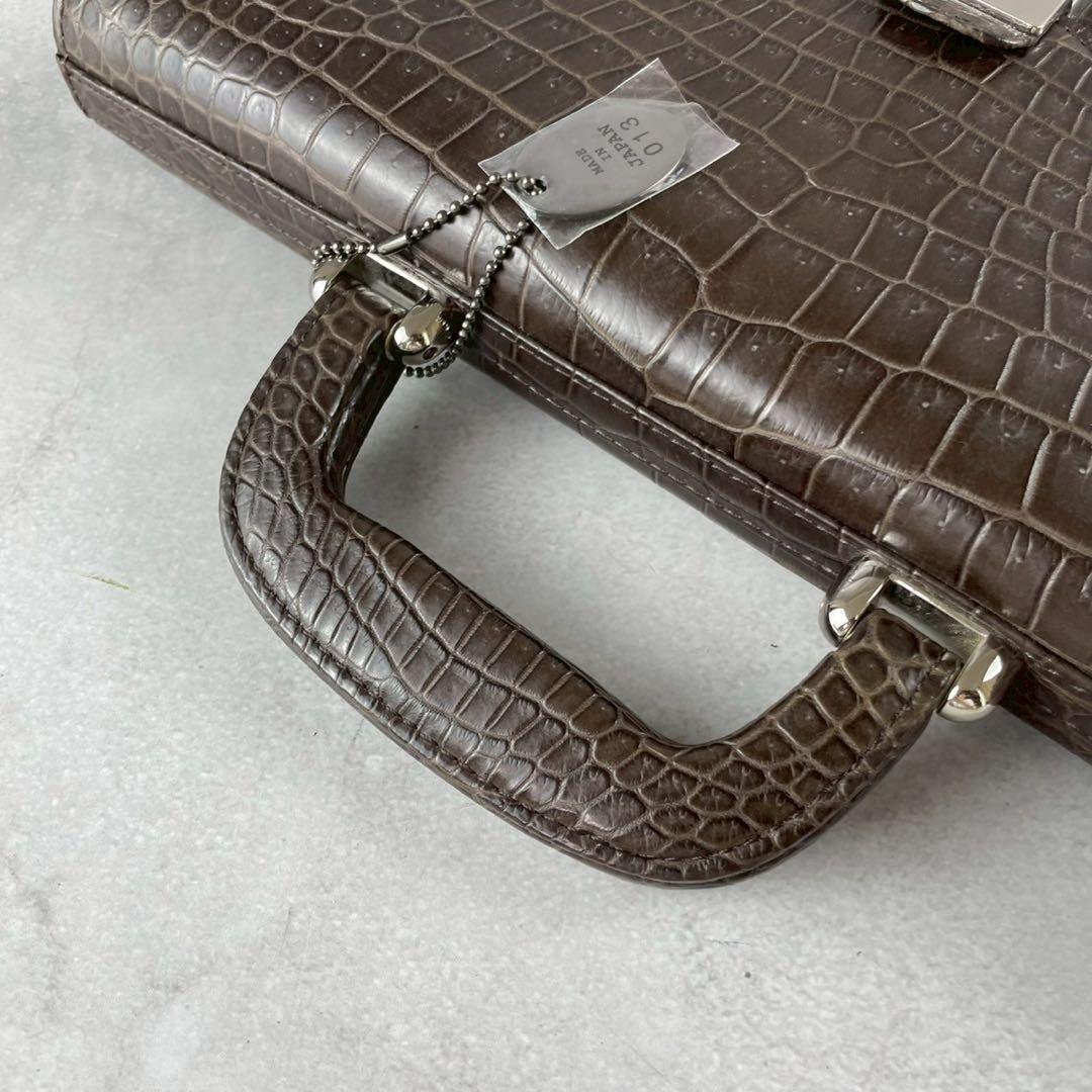 未使用級 クロコダイル ビジネスバッグ 本革 ブラウン系 金具 JRA A4収納