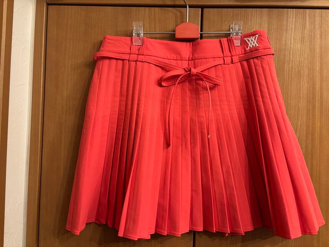 アニユーゴルフ　コーラルピンク プリーツスカート