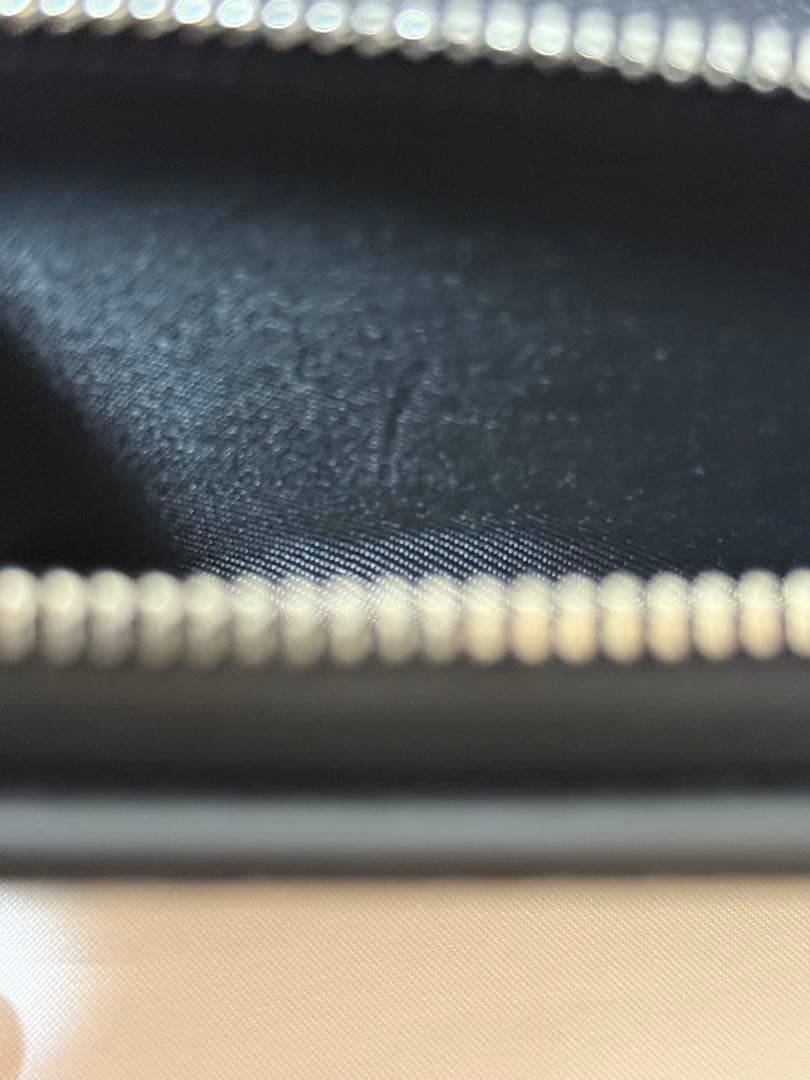 COACH × PEANUTS（スヌーピー）二つ折り財布 型番：C4591