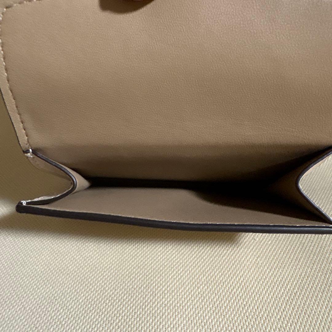 さとる様！専用商品！！COACH 花と蝶のプリント 二つ折り財布