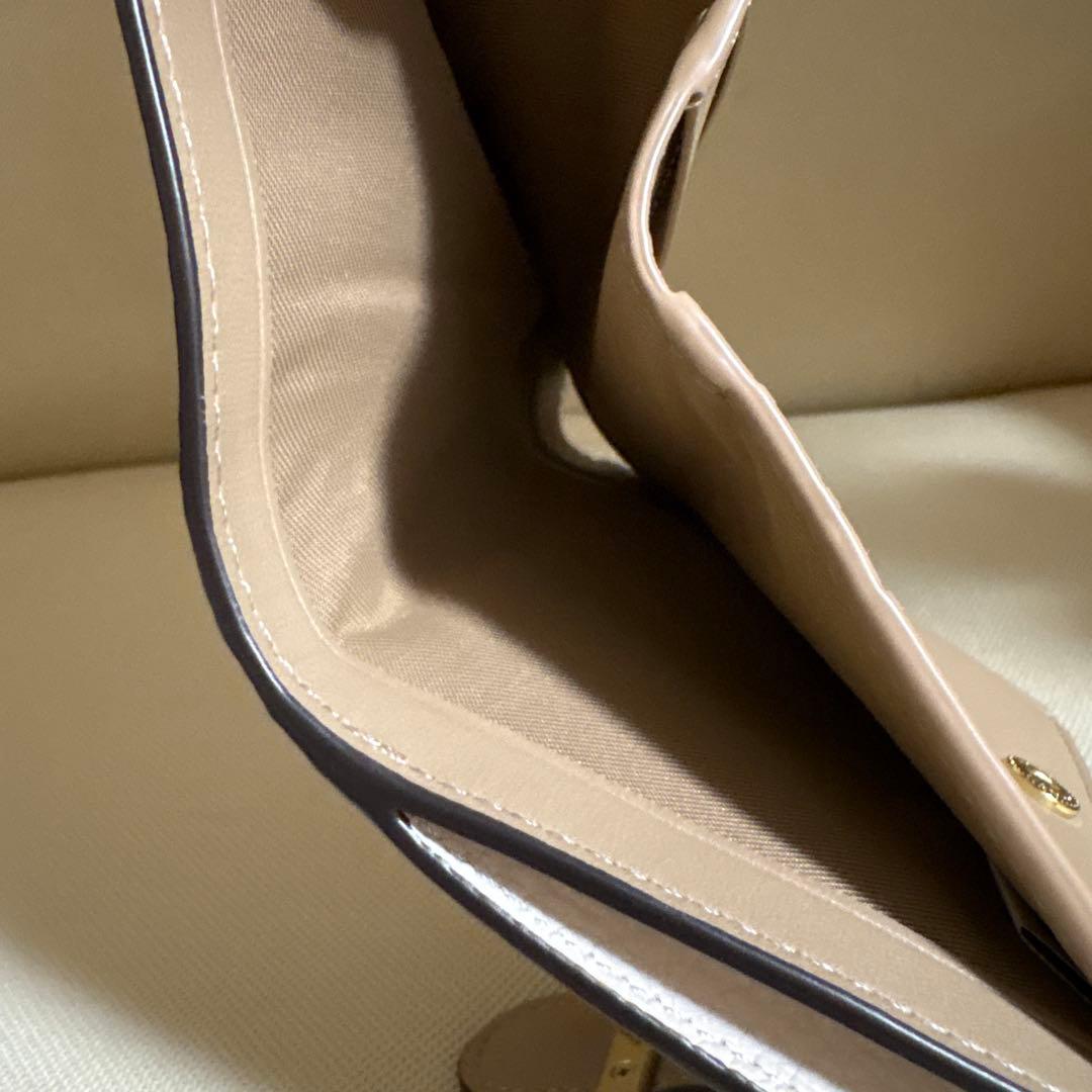 さとる様！専用商品！！COACH 花と蝶のプリント 二つ折り財布