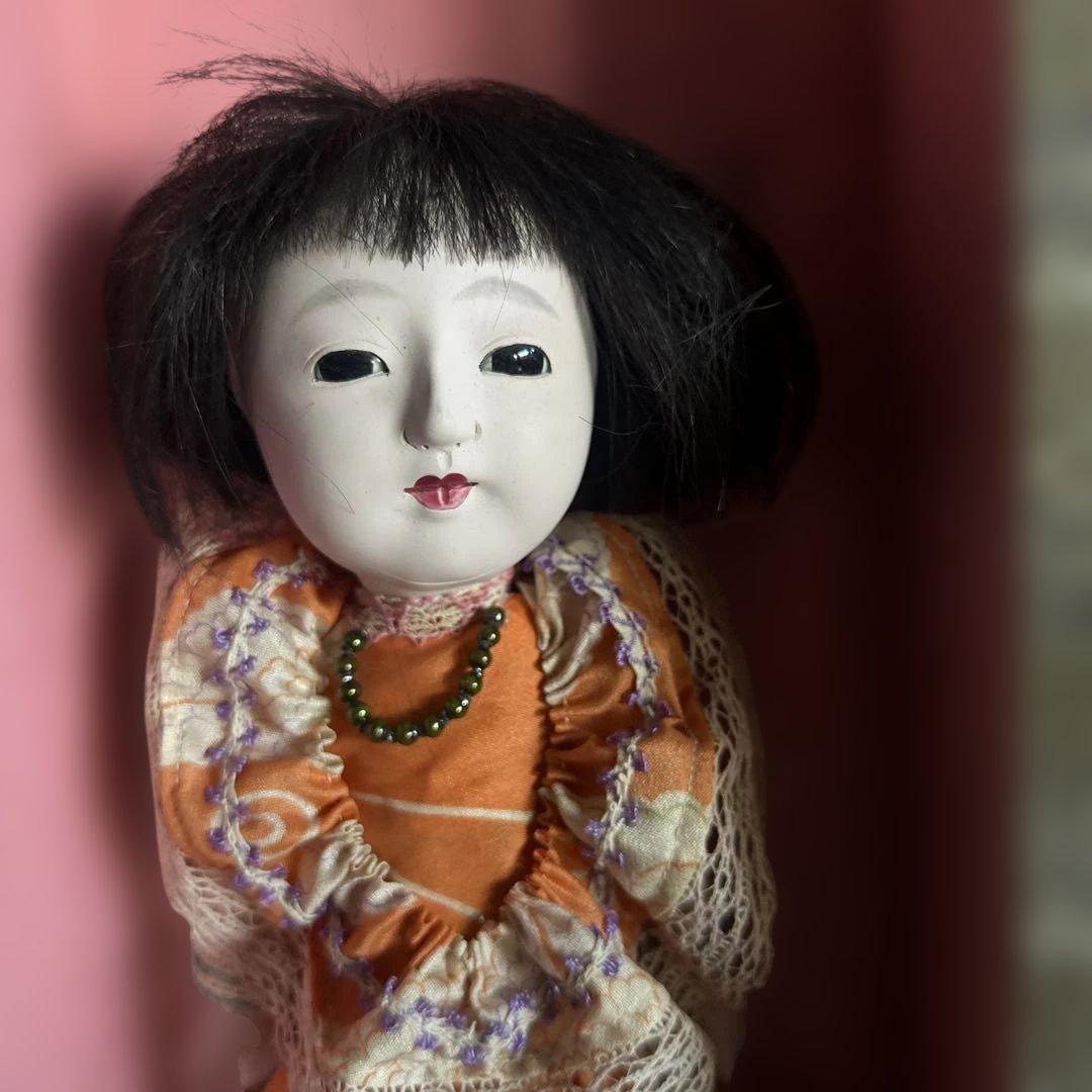 曰く付き…オレンジ色の和装ドレス日本人形