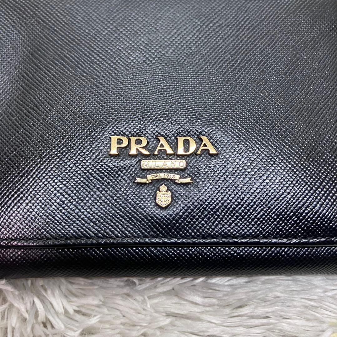 美品✨PRADA サフィアーノ メタルロゴ 二つ折り財布 フラップ ブラック