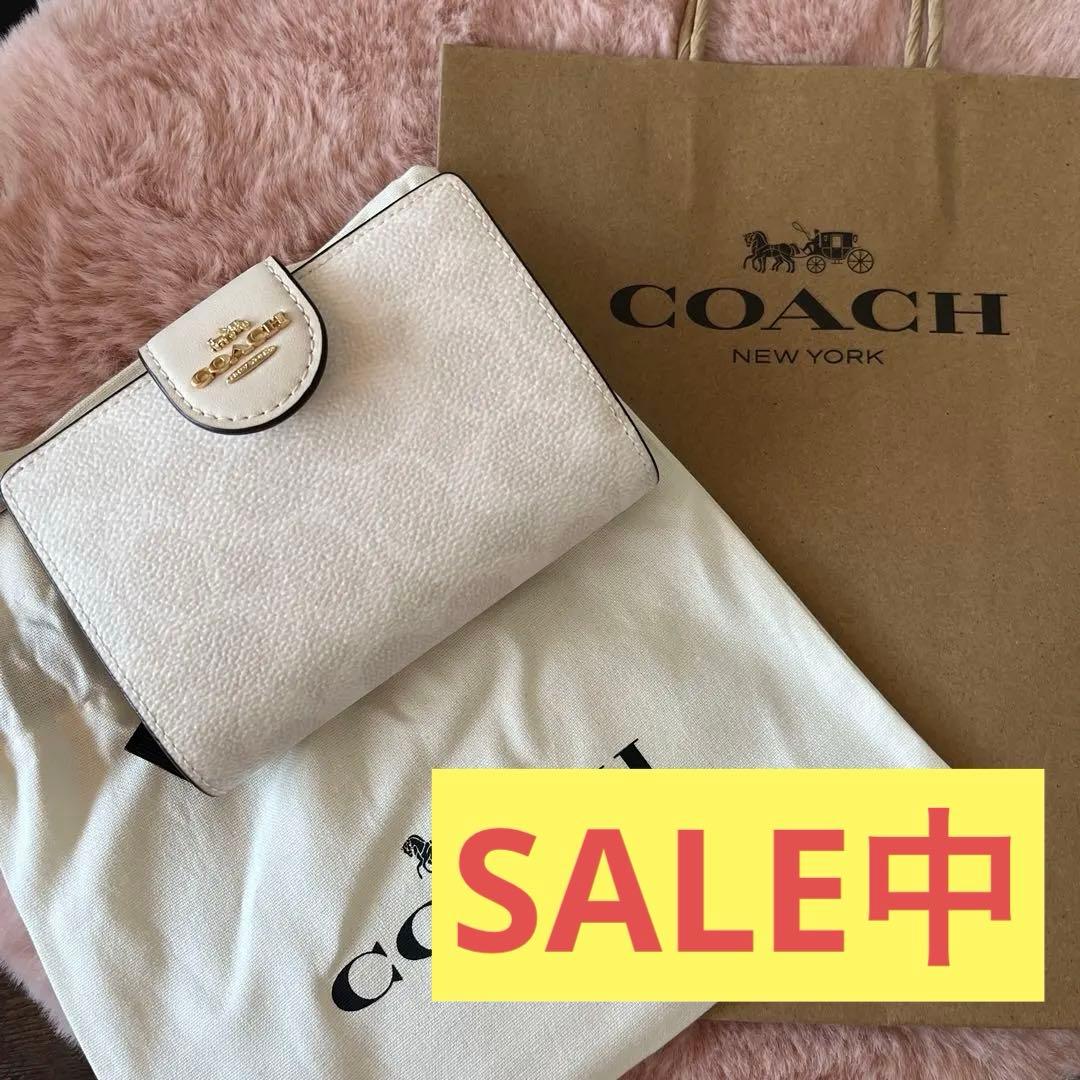 更にSALE 【新品】COACH コーチ　ホワイト　シグネチャー 二つ折り財布