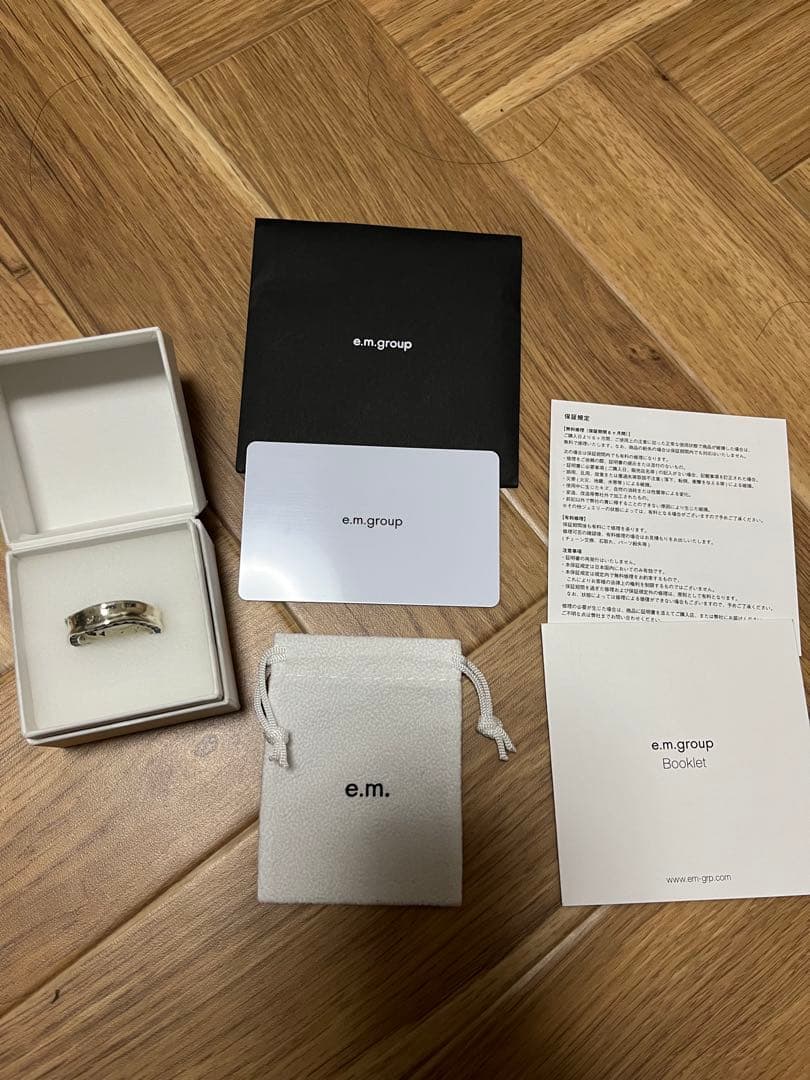 新品同様e.m.両面ジルコニア埋め込みリング☆イーエム