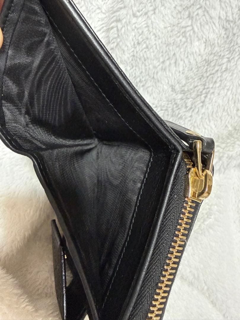 未使用GUCCI 二つ折り財布 ロゴプレート マイクロGG シマレザー 黒